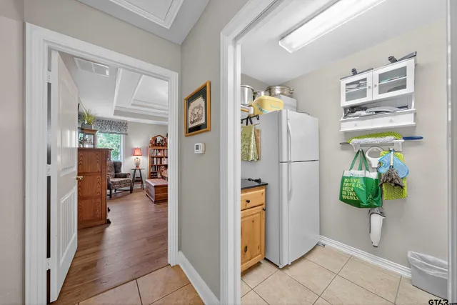 a bedroom that has a bed and a chandelier