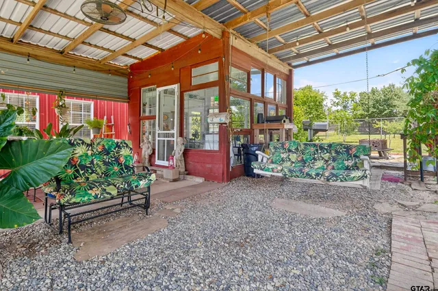 a view of a kitchen with furniture and a chandelier