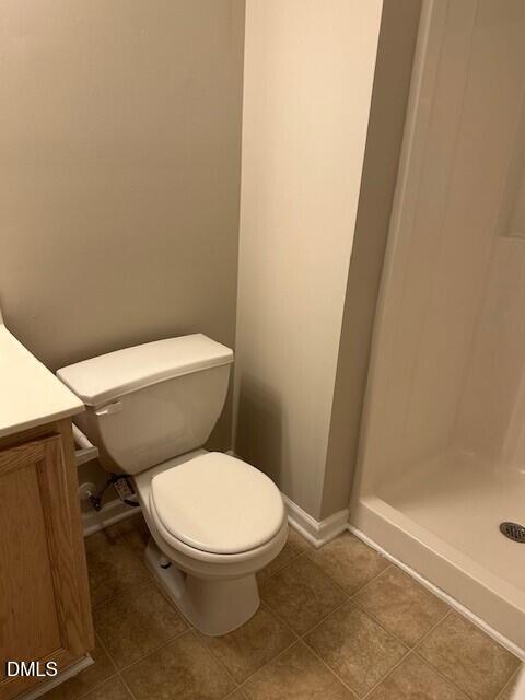 15 Red Lane Raleigh, NC 27606 - Photo 15 of 16 a white toilet sitting next to a shower