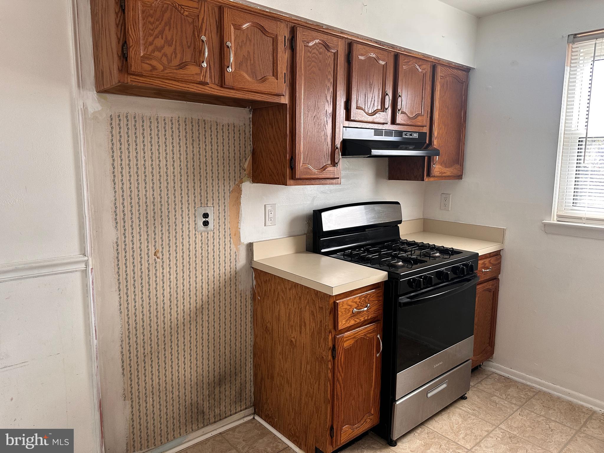 1155 York Rd., Unit C11 Warminster, PA 18974 - Photo 7 of 21 a kitchen with stainless steel appliances granite countertop a stove and a microwave oven