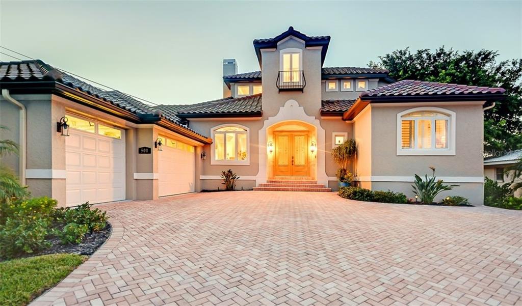 501 Cutter Lane Longboat Key, FL 34228 - Photo 1 of 1 Large paved driveway with 3 car garage w/ elevated entry