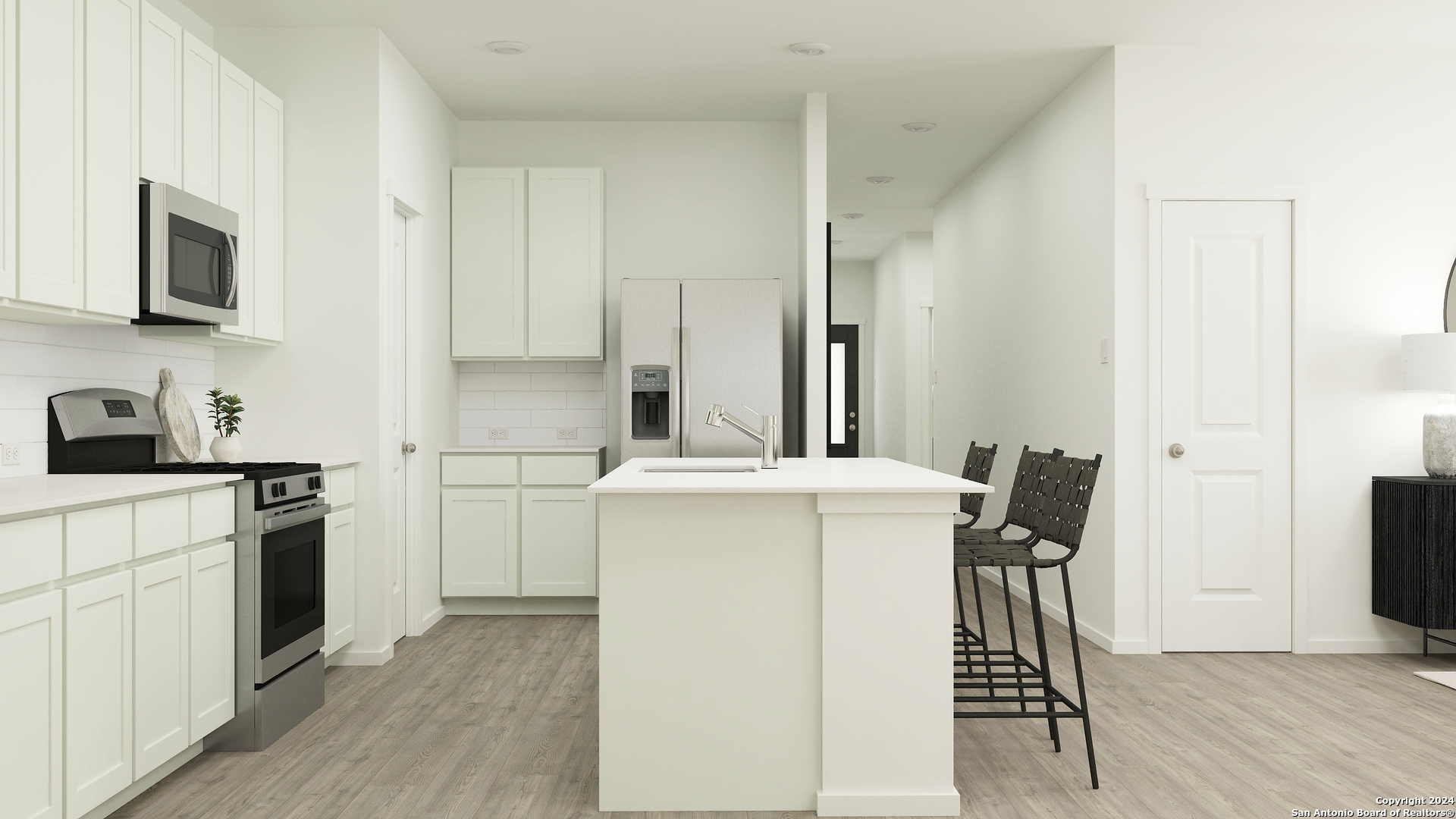 5127 Hagerman Cibolo, TX 78108 - Photo 10 of 27 a kitchen with a stove a sink and a refrigerator
