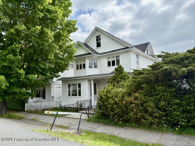 706 Delaware Street Forest City, PA 18421 - Photo 1 of 33 a house that has tree in front of it