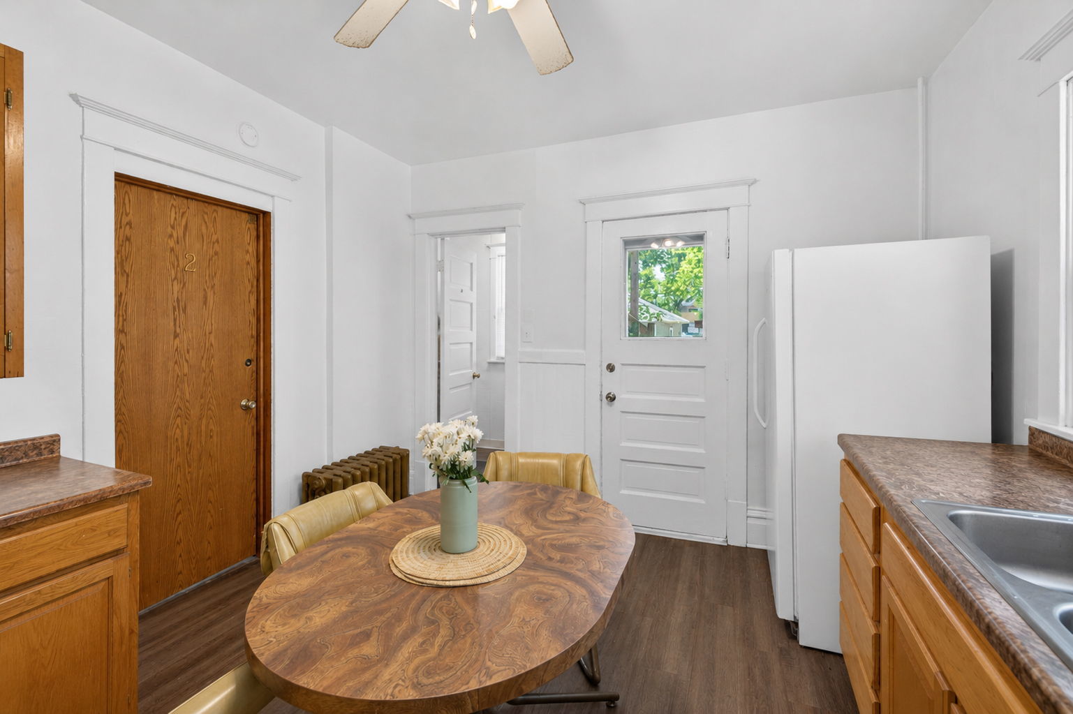 226 West Locust Street DeKalb, IL 60115 - Photo 14 of 40 a kitchen with a table and chairs