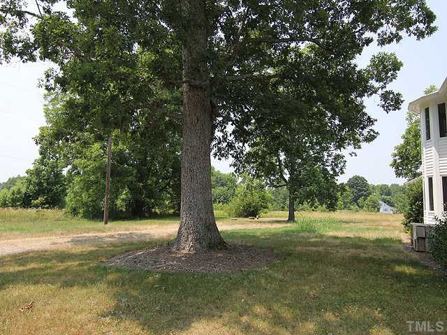 6422 Efland - Cedar Grove Road Cedar Grove, NC 27231 - Photo 12 of 12 a view of a tree in a yard