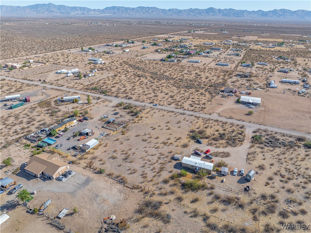 4407 Canelo Road Golden Valley, AZ 86413 - Photo 7 of 11 an aerial view of house with yard and mountain view in back