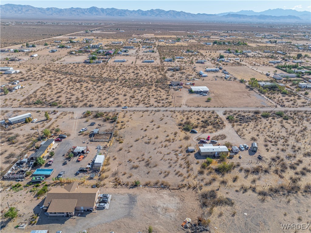 4407 Canelo Road Golden Valley, AZ 86413 - Photo 8 of 11 an aerial view of residential house and sandy dunes