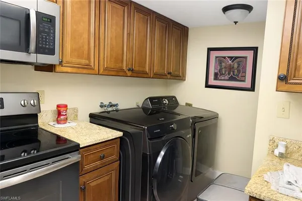 a utility room with dryer and washer