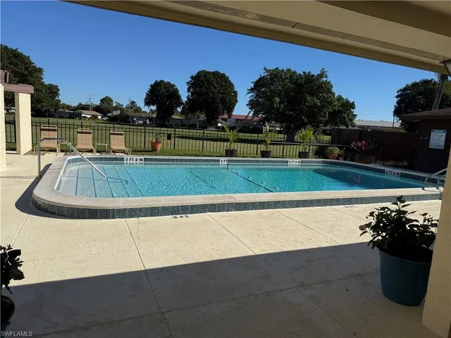 a view of a garden with a house