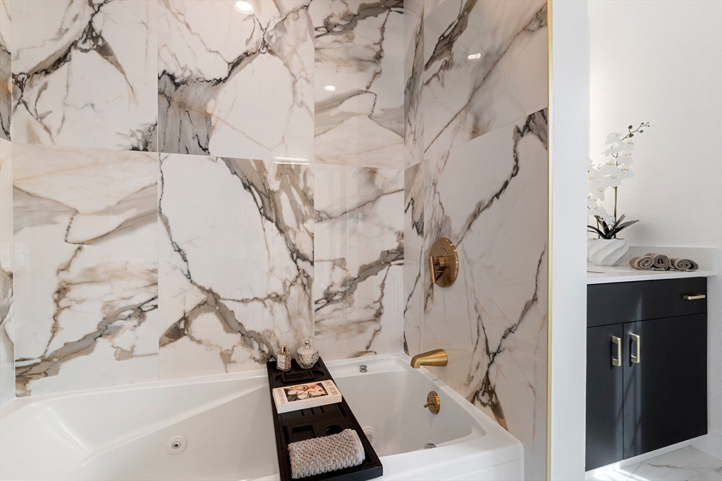 4 Blacksmith Way Saugus, MA 01906 - Photo 17 of 42 a bathroom with a bathtub and sink