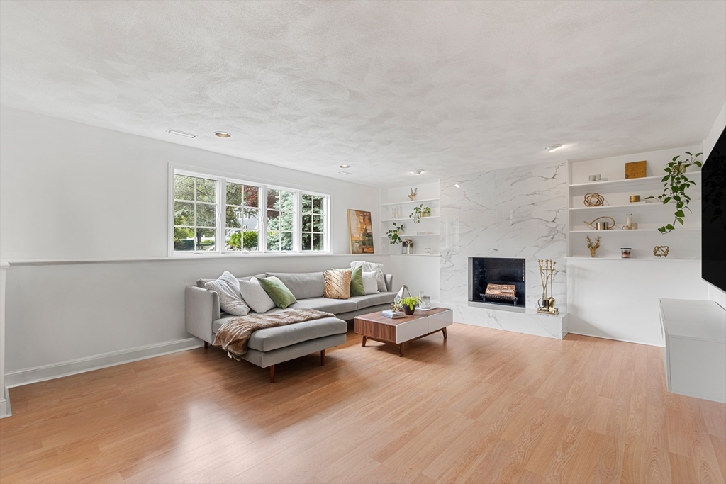 4 Blacksmith Way Saugus, MA 01906 - Photo 24 of 42 a living room with furniture and a fireplace