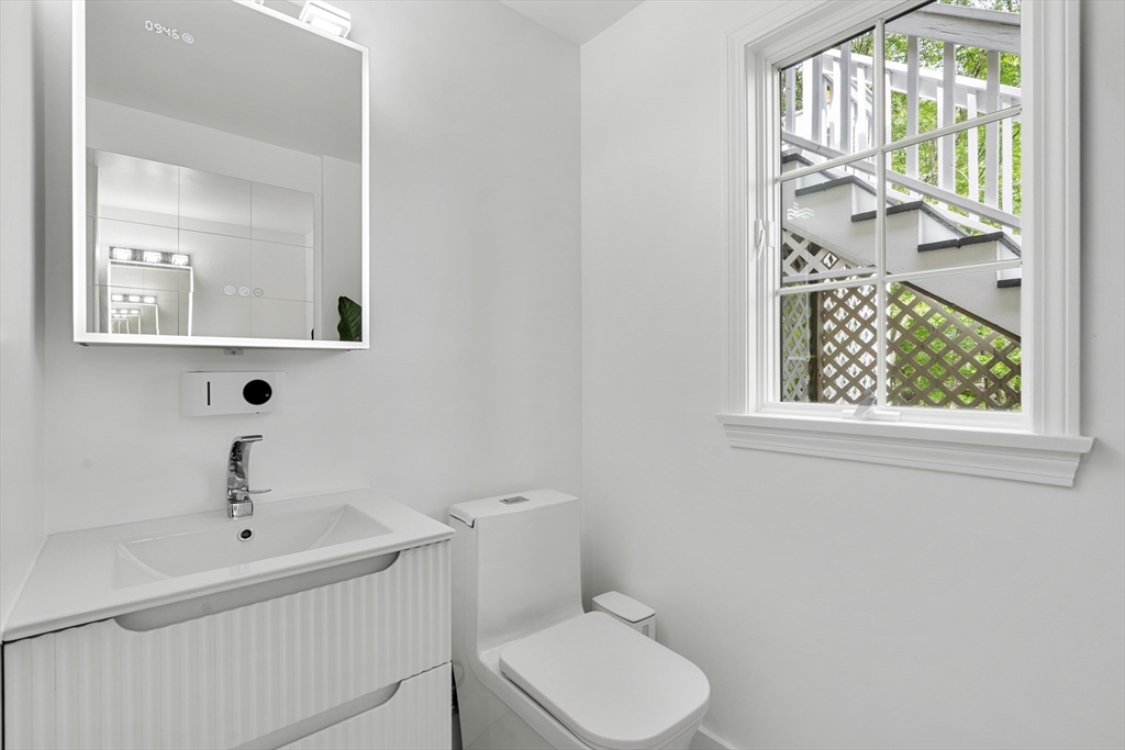 4 Blacksmith Way Saugus, MA 01906 - Photo 28 of 42 a bathroom with a toilet sink and mirror