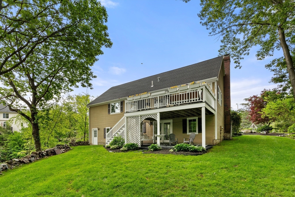 4 Blacksmith Way Saugus, MA 01906 - Photo 30 of 42 a front view of a house with a garden