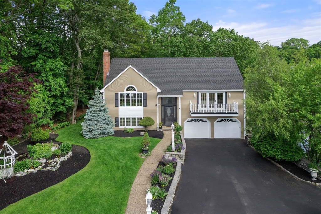 4 Blacksmith Way Saugus, MA 01906 - Photo 4 of 42 a house view with a garden space