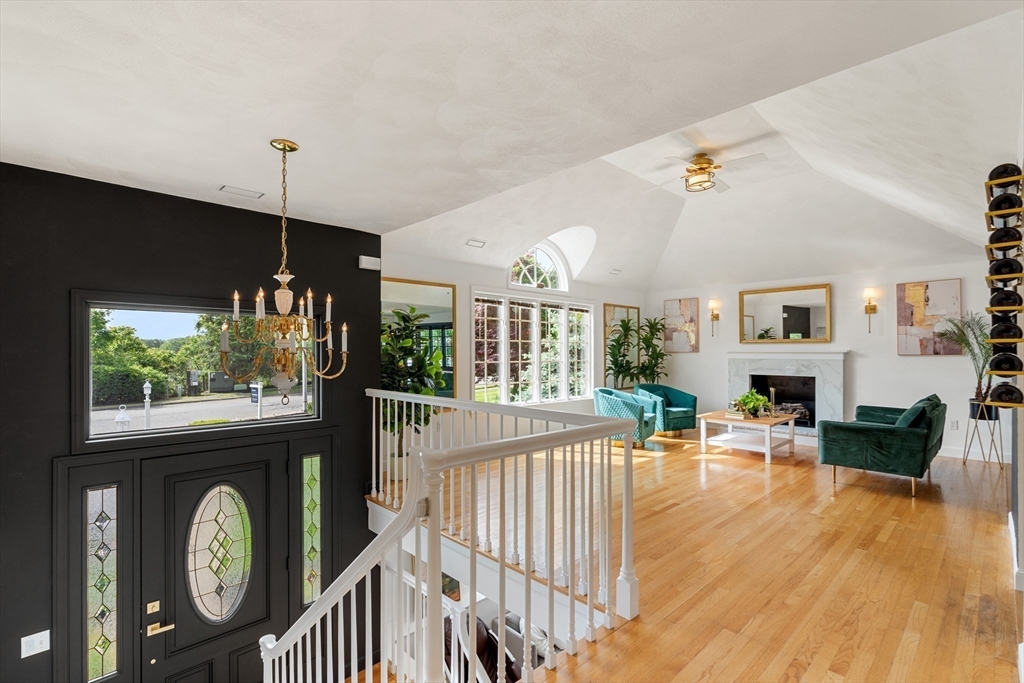 4 Blacksmith Way Saugus, MA 01906 - Photo 5 of 42 a living room with furniture a large window and wooden floor