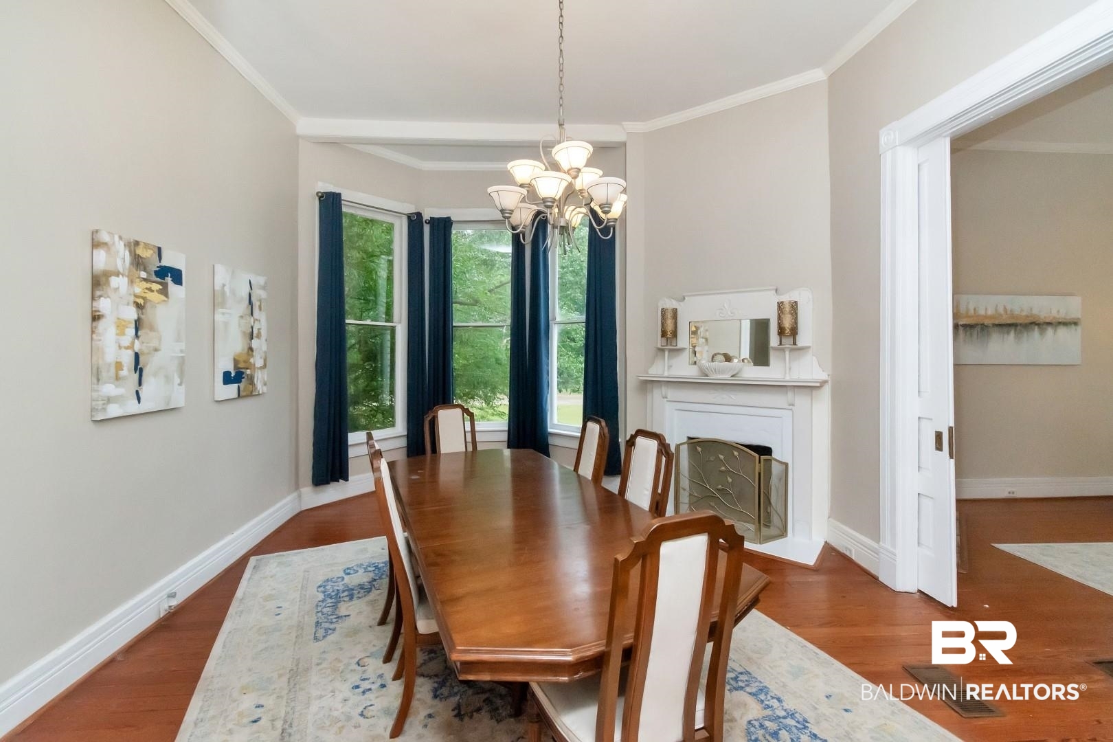 1305 Brown Street Mobile, AL 36604 - Photo 4 of 37 Dining area with a notable chandelier, ornamental molding, and hardwood / wood-style flooring