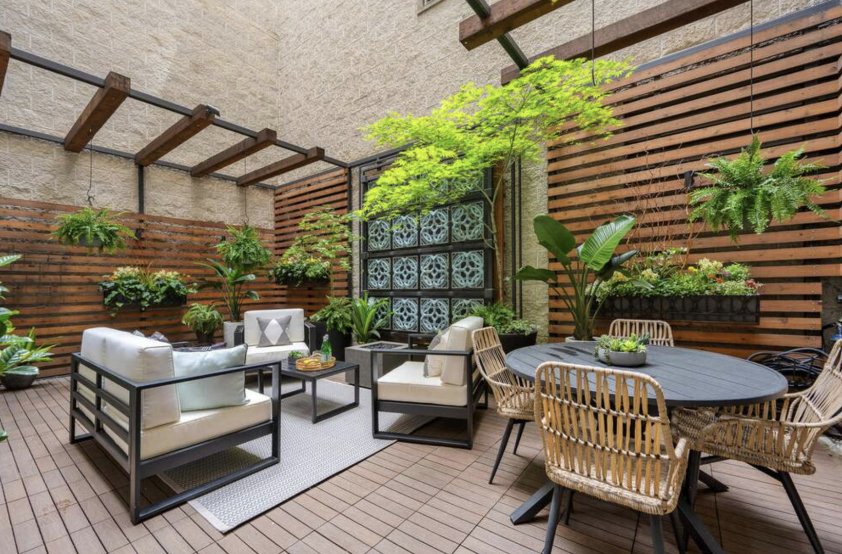 1112 North Dearborn Street, Unit 1 Chicago, IL 60610 - Photo 17 of 34 a view of a patio with couches table and chairs and potted plants