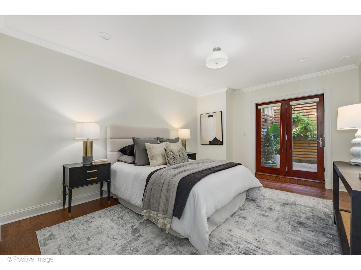 1112 North Dearborn Street, Unit 1 Chicago, IL 60610 - Photo 25 of 34 a bedroom with a bed and a large window