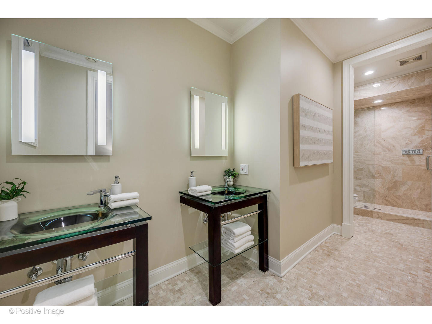 1112 North Dearborn Street, Unit 1 Chicago, IL 60610 - Photo 27 of 34 a kitchen with granite countertop a sink cabinets and a wooden floor