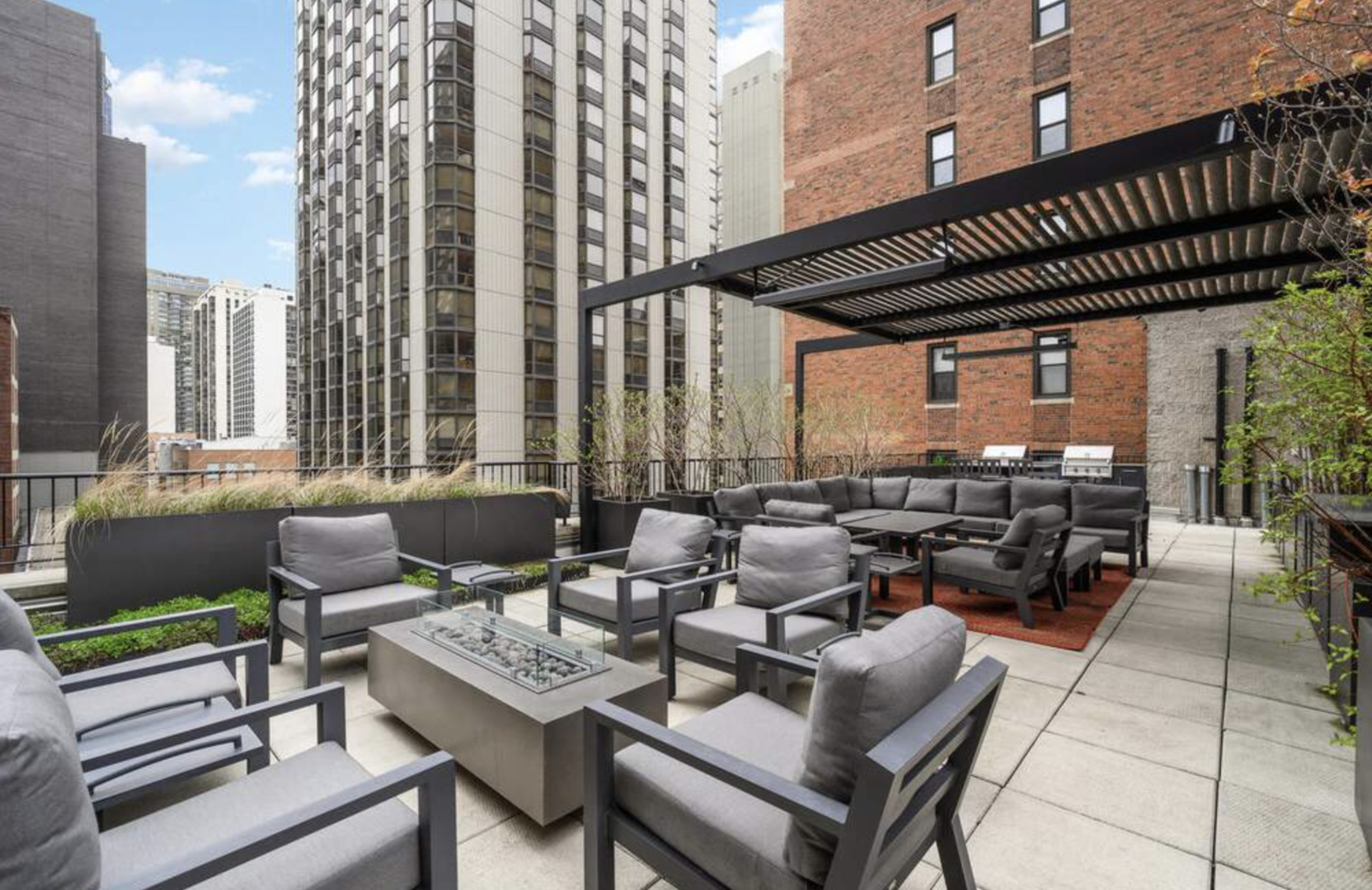 1112 North Dearborn Street, Unit 1 Chicago, IL 60610 - Photo 29 of 34 a view of a patio with couches table and chairs and potted plants