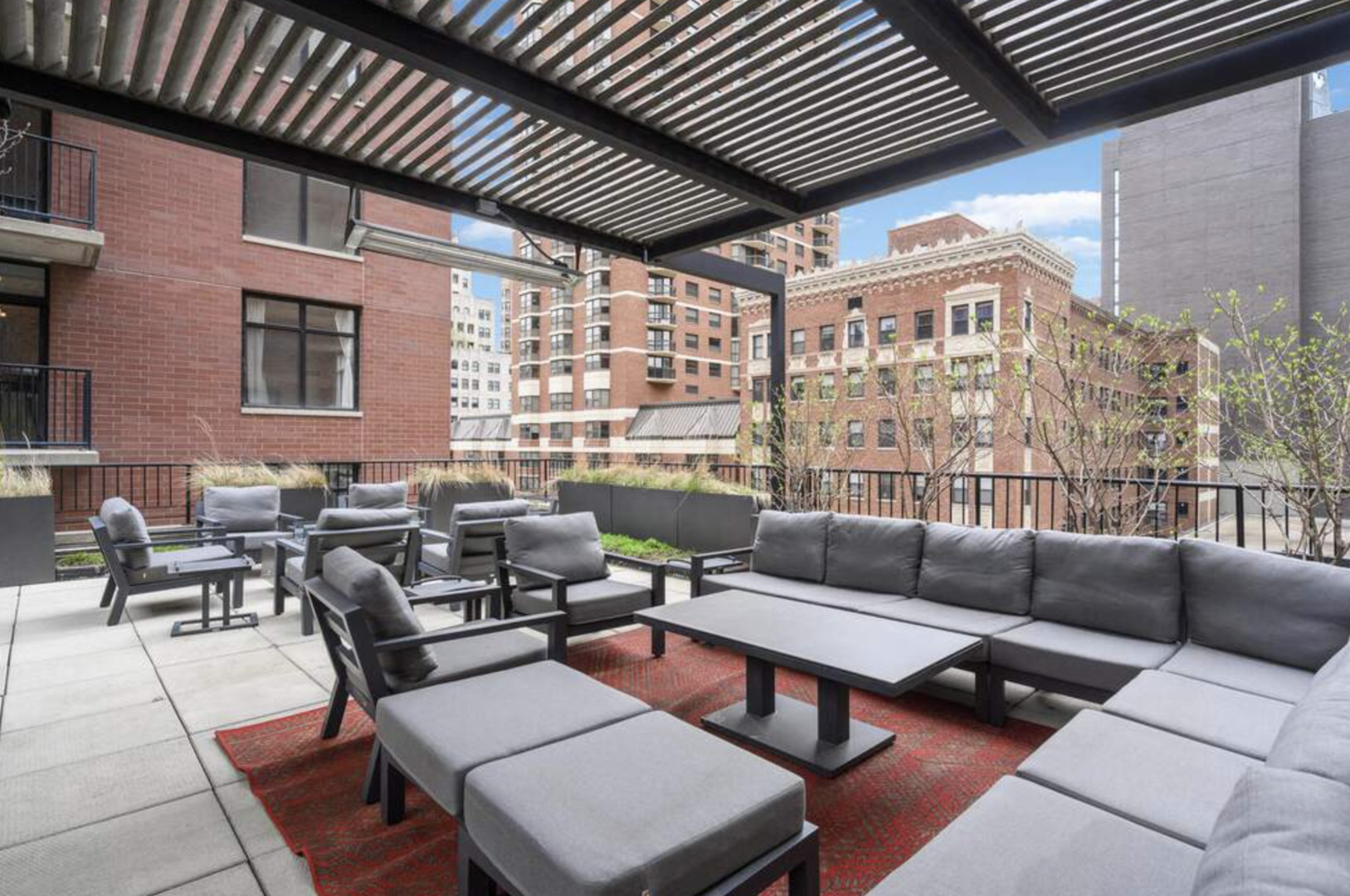 1112 North Dearborn Street, Unit 1 Chicago, IL 60610 - Photo 31 of 34 a outdoor living space with patio furniture and a potted plant