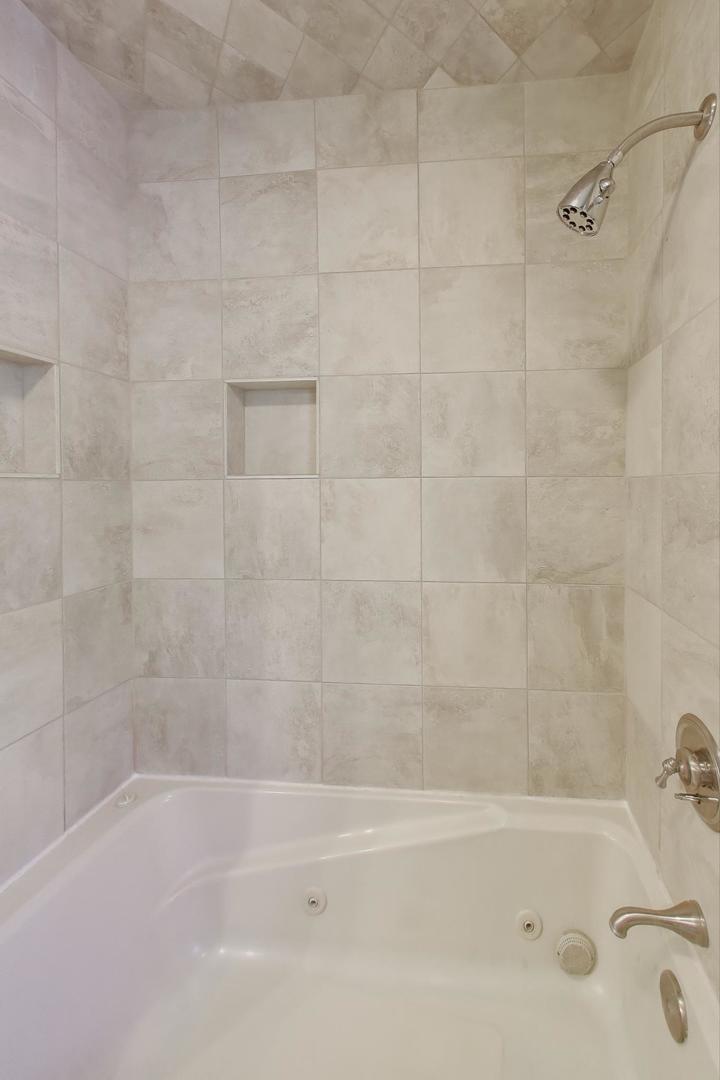 927 Half Day Road Highland Park, IL 60035 - Photo 13 of 20 a bathroom with a bathtub