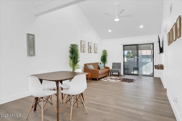 a living room with furniture and a table