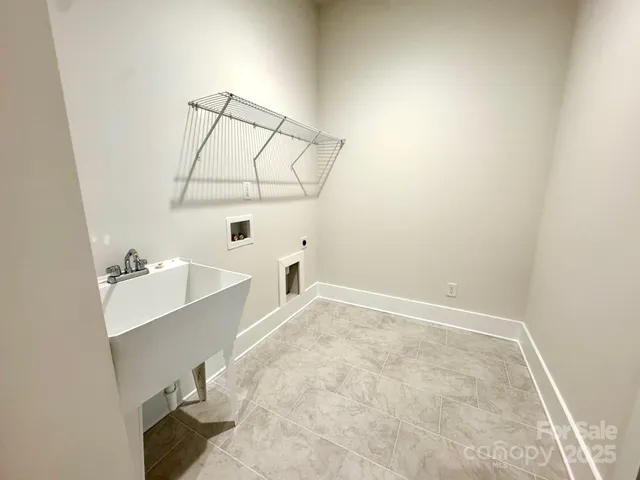 a bathroom with a sink and mirror