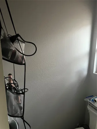 a kitchen with a refrigerator and a chandelier