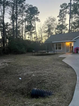 a backyard of a house with lots of green space