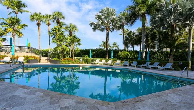 a view of swimming pool with chairs