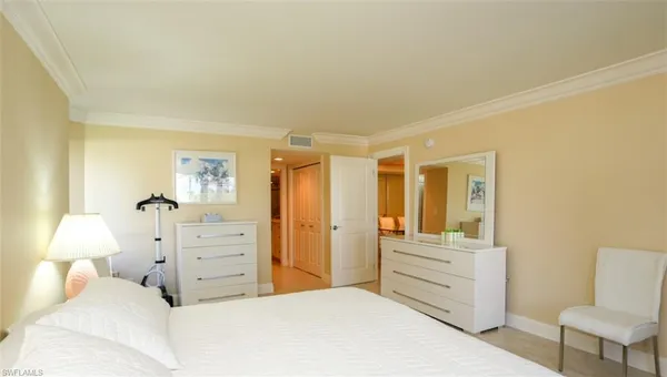 a bedroom with a bed and furniture