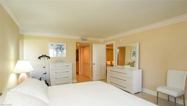 a bedroom with a bed and furniture