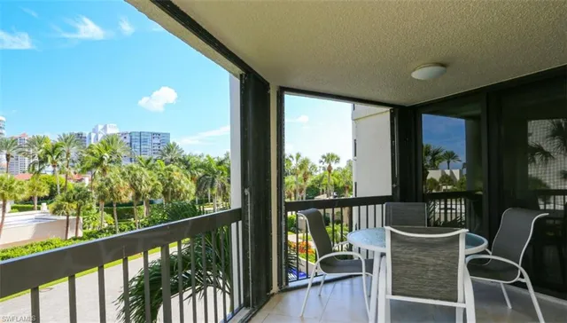 a view of a chairs and table in patio
