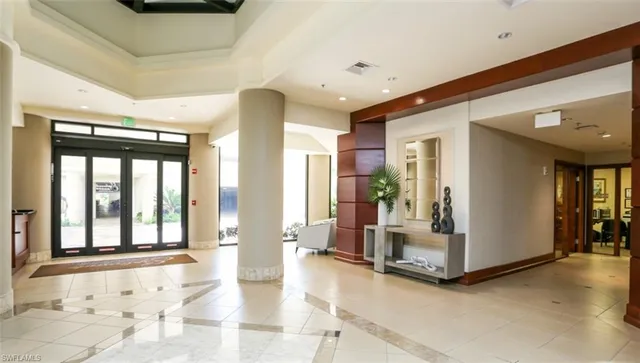 a view of an entryway with wooden floor and windows