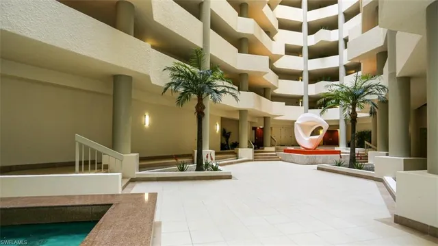a view of a lobby with a garage and a fireplace