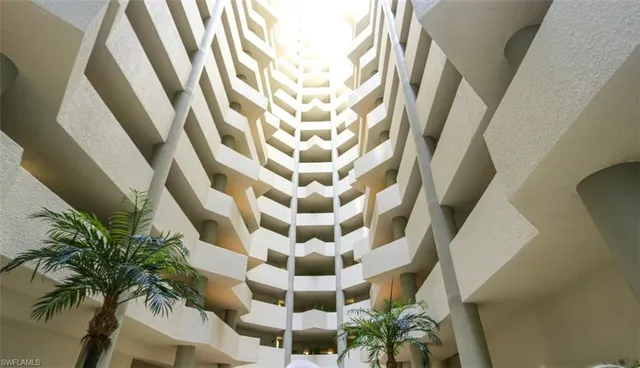 a view of a multi story residential apartment building with entryway