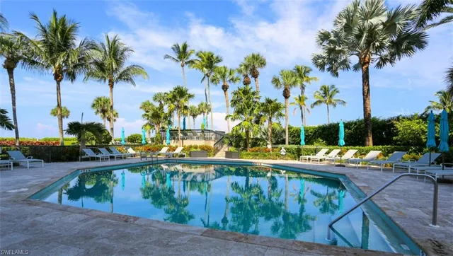 a view of swimming pool with a patio