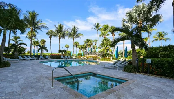 a view of a backyard with a sitting area