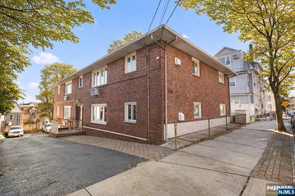 539 Undercliff Avenue, Unit 4 Edgewater, NJ 07020 - Photo 15 of 15 a front view of a house with a yard