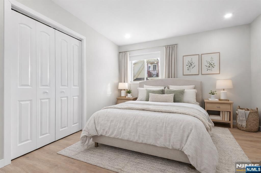 539 Undercliff Avenue, Unit 4 Edgewater, NJ 07020 - Photo 4 of 15 a bedroom with a bed and a window