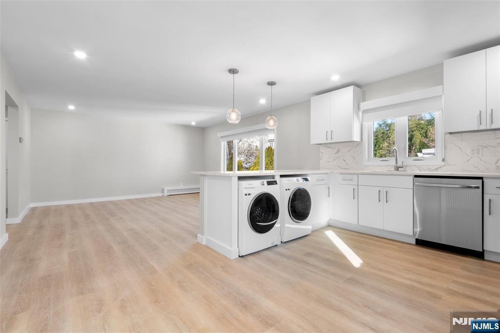539 Undercliff Avenue, Unit 4 Edgewater, NJ 07020 - Photo 8 of 15 a view of a kitchen with stove top oven and cabinets