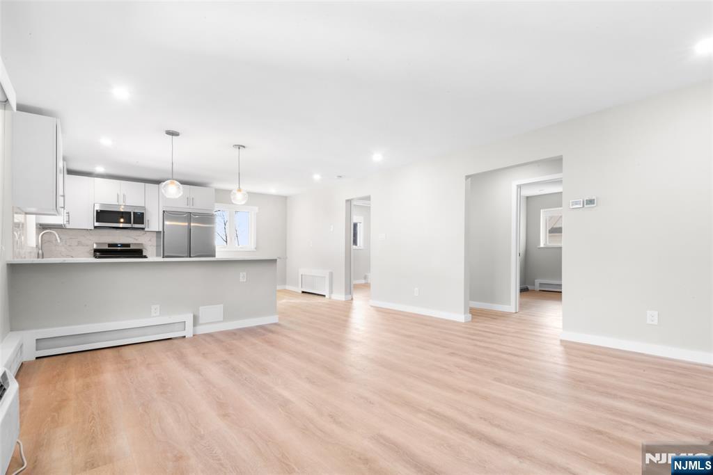 539 Undercliff Avenue, Unit 4 Edgewater, NJ 07020 - Photo 10 of 15 a view of kitchen with wooden floor