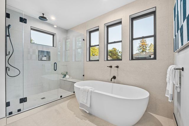 a spacious bathroom with a double vanity sink and a mirror