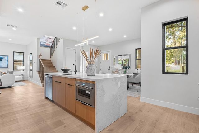 a view of living room with granite countertop furniture and a wooden floor