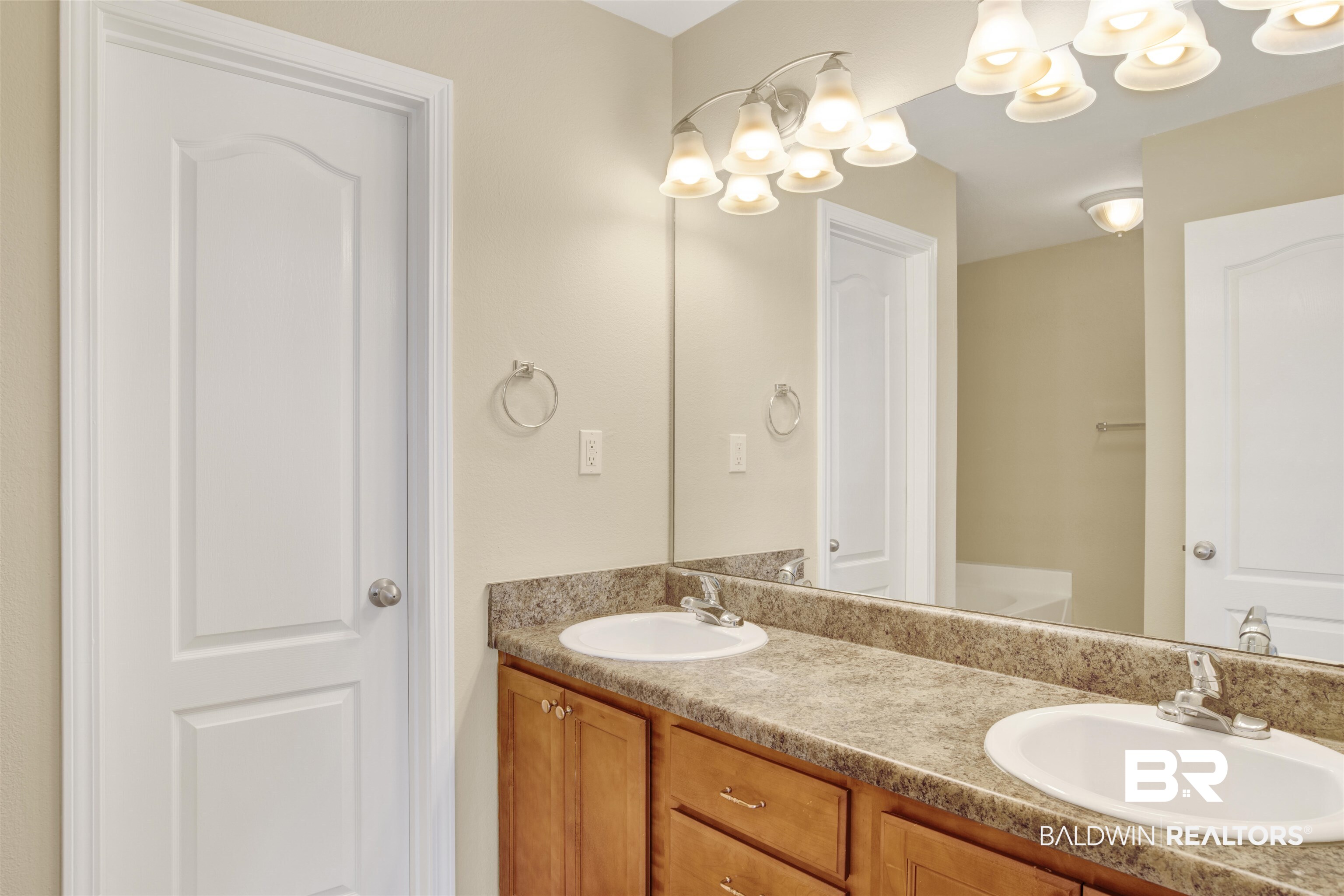 2002 Shelene Way Foley, AL 36535 - Photo 14 of 23 Full bathroom with double vanity and a chandelier