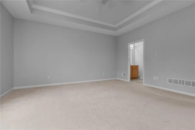 a view of an empty room and entryway