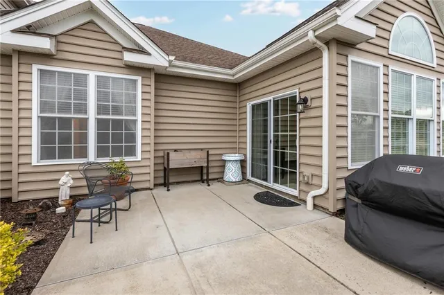 a balcony with furniture and with window