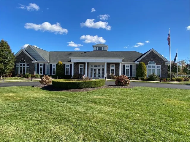 a view of a house with a yard porch and sitting area