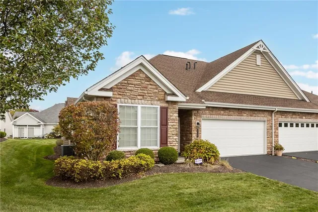front view of a house with a yard